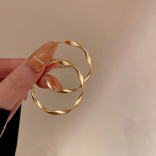 Gempoetry |Dumb gold twisted plain circle earrings for women 2024 new popular style, niche design, personalized plain circle, light luxury and fashionable earrings